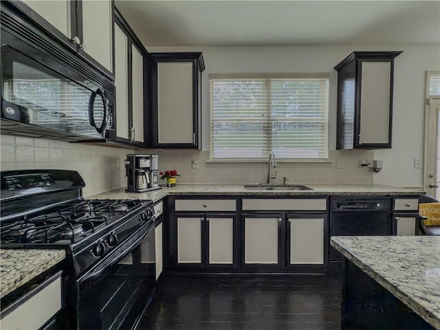 3318 Sardis Bend Dr, Buford, GA 30519 - kitchen with black appliances, a sink, backsplash, and light stone counters