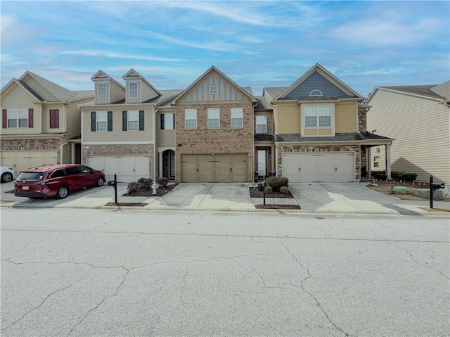 3318 Sardis Bend Dr, Buford, GA 30519 - townhome / multi-family property with an attached garage, driveway, and board and batten siding