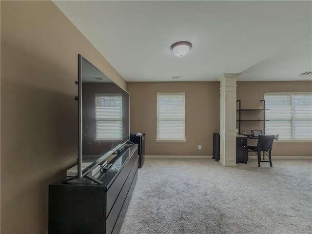 3318 Sardis Bend Dr, Buford, GA 30519 - living area featuring ornate columns, light carpet, and baseboards