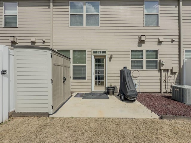 3318 Sardis Bend Dr, Buford, GA 30519 - back of house featuring central AC unit and a patio area