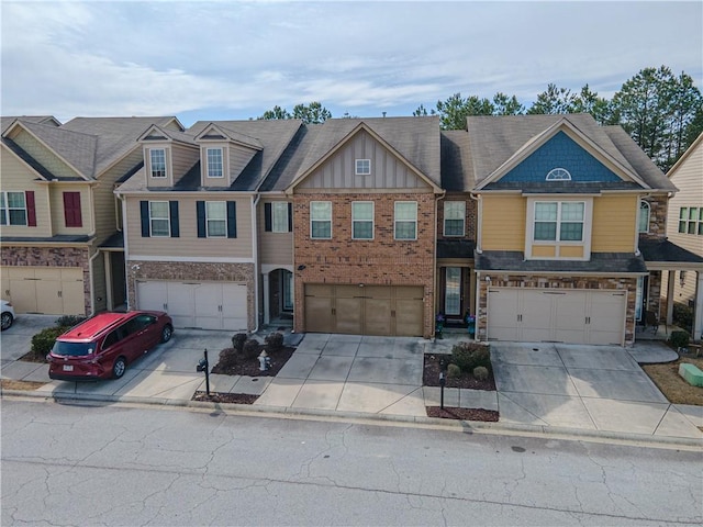 3318 Sardis Bend Dr, Buford, GA 30519 - view of property featuring a garage, driveway, and board and batten siding