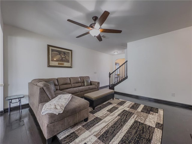 3318 Sardis Bend Dr, Buford, GA 30519 - living area featuring a ceiling fan, stairs, arched walkways, and baseboards