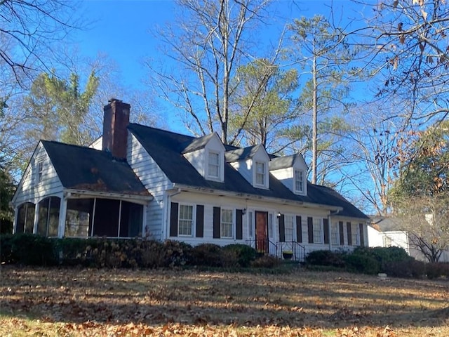 view of side of home featuring a sunroom