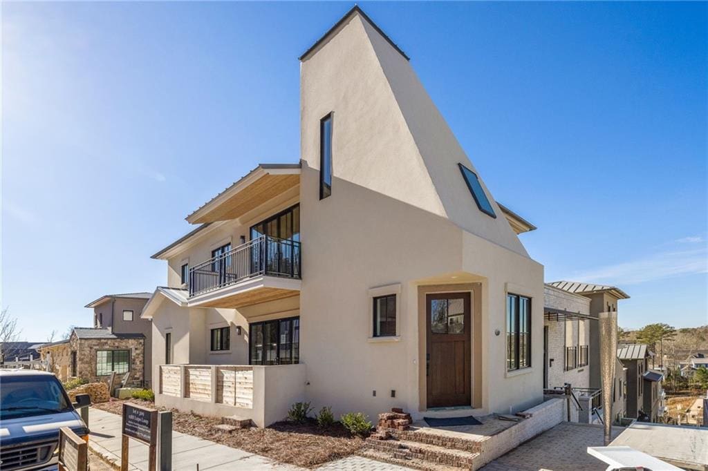 view of front of home with a balcony