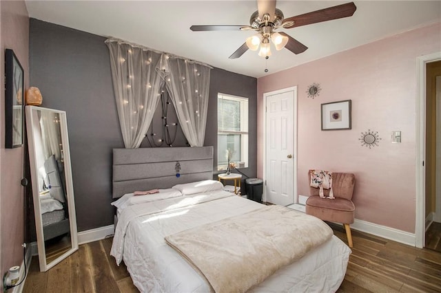 bedroom featuring ceiling fan and dark hardwood / wood-style flooring