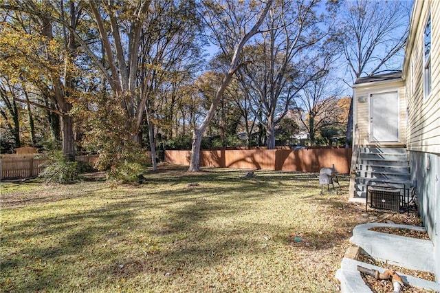 view of yard featuring central AC unit