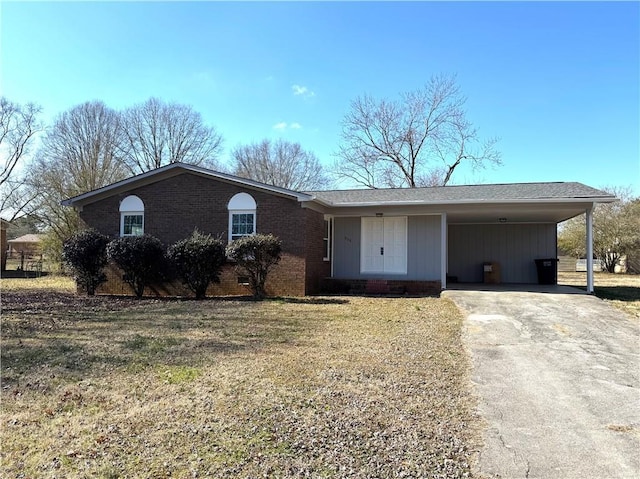 ranch-style house with a front lawn and a carport