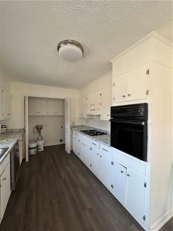 kitchen with white cabinets, dark hardwood / wood-style floors, light stone countertops, and black appliances