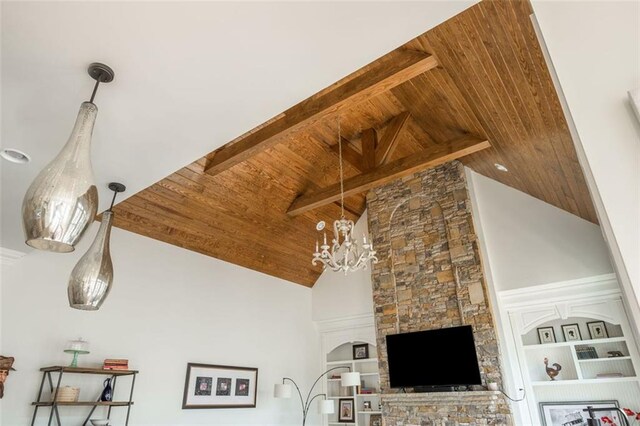 details featuring an inviting chandelier, wood ceiling, and beamed ceiling