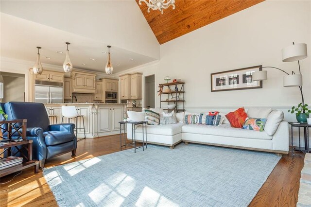 living room with wood ceiling, high vaulted ceiling, and light wood-style flooring