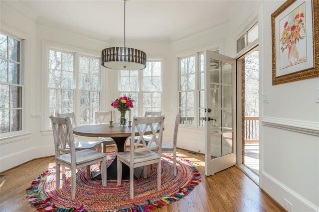 sunroom / solarium featuring french doors