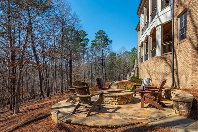 view of patio / terrace with a fire pit