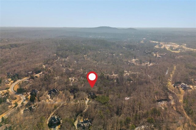 bird's eye view featuring a mountain view and a forest view