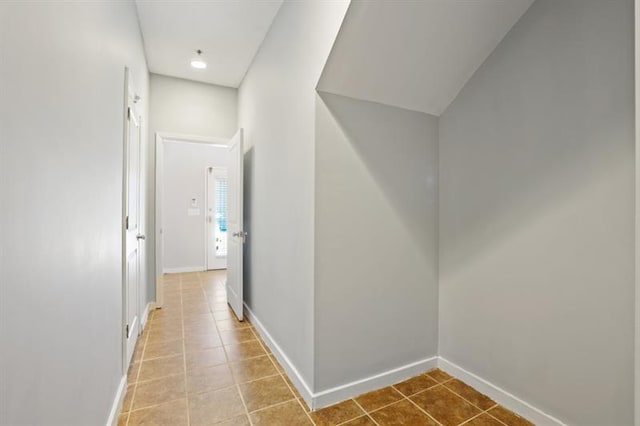 hallway featuring tile patterned flooring