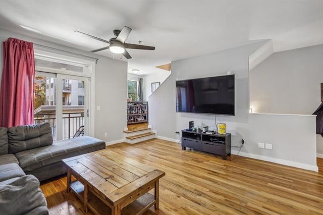 living room featuring ceiling fan and hardwood / wood-style floors