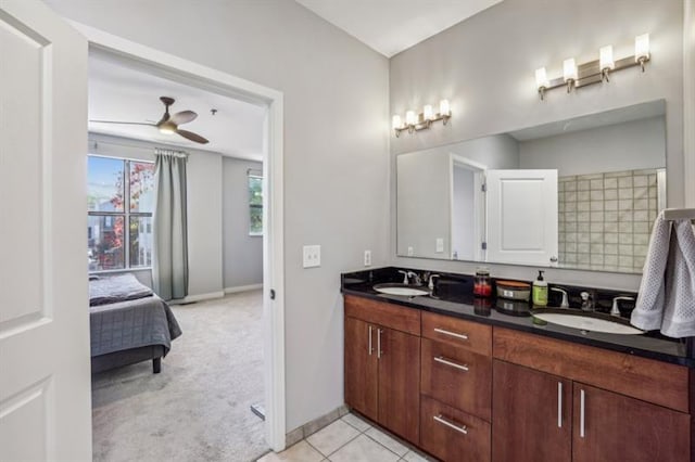 bathroom with tile patterned flooring, ceiling fan, and vanity