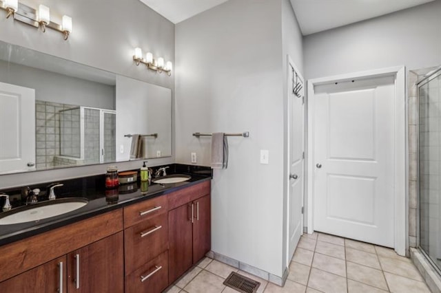 bathroom featuring vanity, tile patterned floors, and an enclosed shower