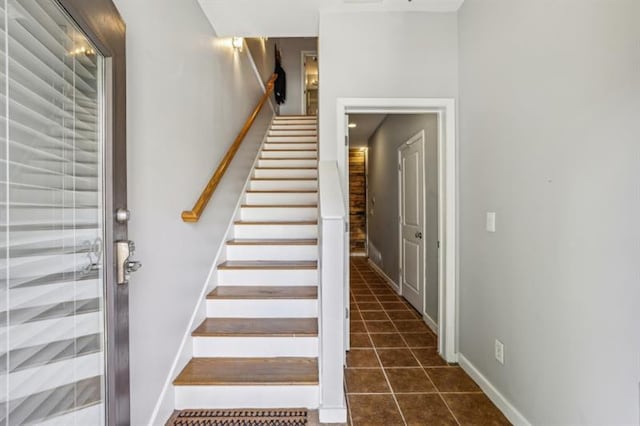 staircase with tile patterned flooring