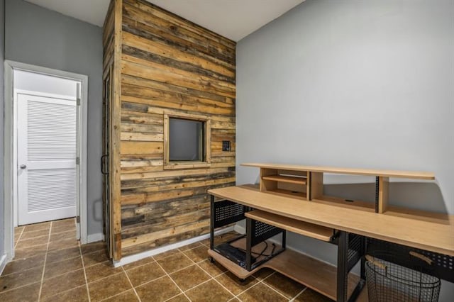 dining area with wood walls