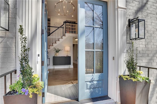 doorway to property with brick siding