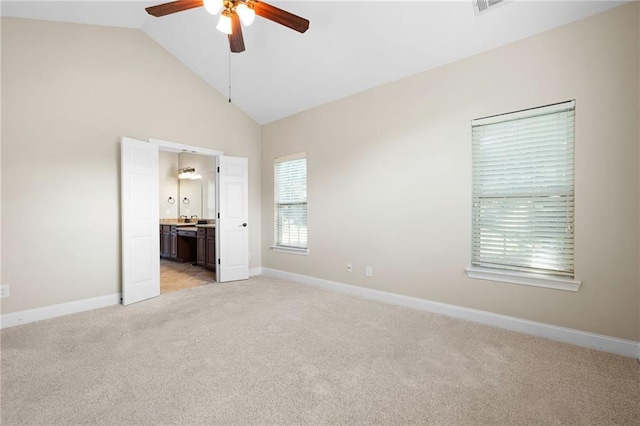 120 Chastain Rd NW Unit 1204, Kennesaw, GA 30144 - unfurnished bedroom with baseboards, high vaulted ceiling, ensuite bathroom, and light colored carpet