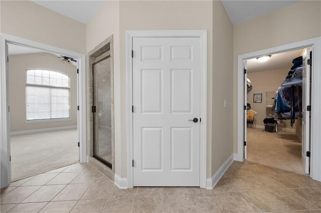 120 Chastain Rd NW Unit 1204, Kennesaw, GA 30144 - corridor featuring light tile patterned flooring, baseboards, and light colored carpet