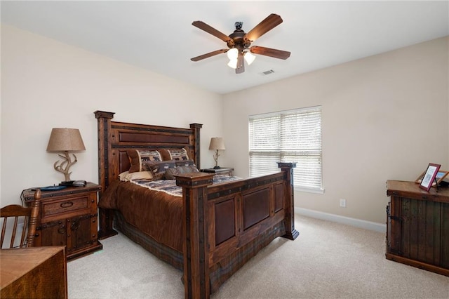 120 Chastain Rd NW Unit 1204, Kennesaw, GA 30144 - bedroom with light carpet, baseboards, visible vents, and a ceiling fan
