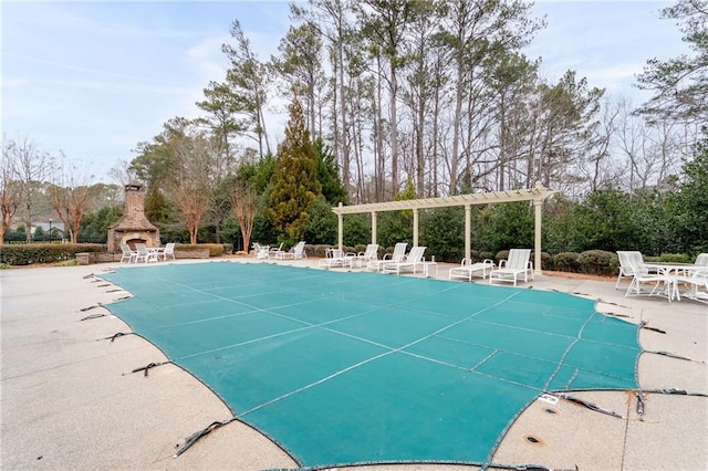 120 Chastain Rd NW Unit 1204, Kennesaw, GA 30144 - pool featuring an outdoor stone fireplace, a pergola, and a patio area