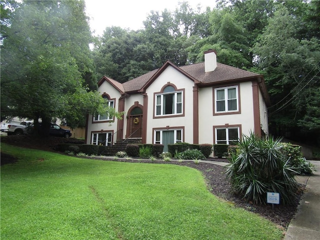 5820 Elm Tree Dr, Buford, GA 30518 - view of front of house with stucco siding, a chimney, a front lawn, and roof with shingles