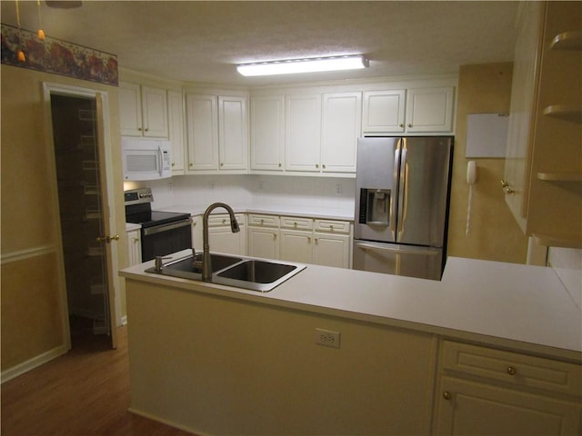 5820 Elm Tree Dr, Buford, GA 30518 - kitchen with white microwave, range with electric stovetop, stainless steel refrigerator with ice dispenser, and white cabinetry