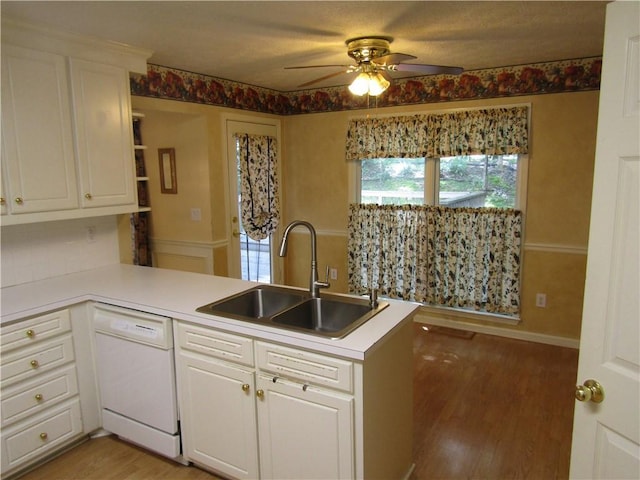 5820 Elm Tree Dr, Buford, GA 30518 - kitchen with dishwasher, ceiling fan, a peninsula, light wood-type flooring, and white cabinetry