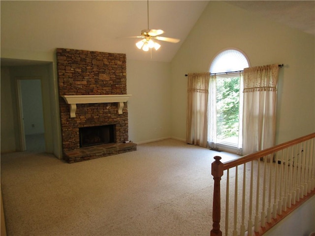 5820 Elm Tree Dr, Buford, GA 30518 - carpeted living area with healthy amount of natural light, a ceiling fan, high vaulted ceiling, and a fireplace
