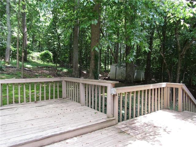 5820 Elm Tree Dr, Buford, GA 30518 - wooden deck featuring a storage shed