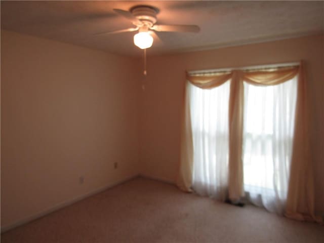 5820 Elm Tree Dr, Buford, GA 30518 - unfurnished room with a ceiling fan and light carpet
