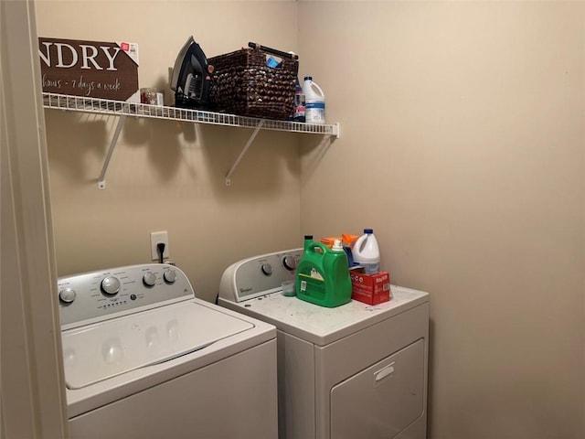 laundry area with laundry area and independent washer and dryer