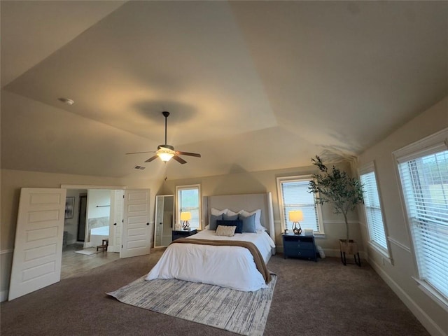 bedroom with lofted ceiling, multiple windows, and carpet