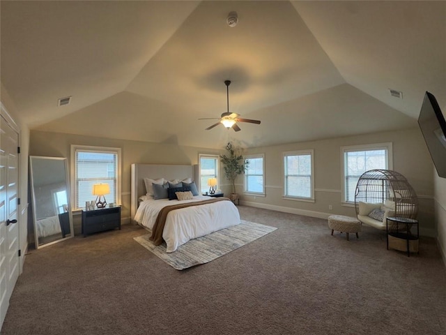 unfurnished bedroom with visible vents, carpet floors, and vaulted ceiling