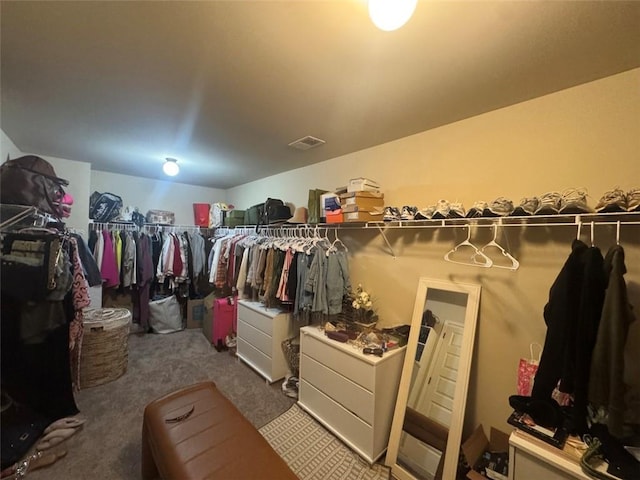 spacious closet with carpet flooring and visible vents