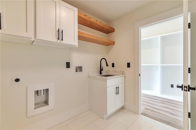 2808 S Arbor Dr, Gainesville, GA 30507 - laundry room featuring hookup for a washing machine, light tile patterned floors, hookup for an electric dryer, baseboards, and cabinet space