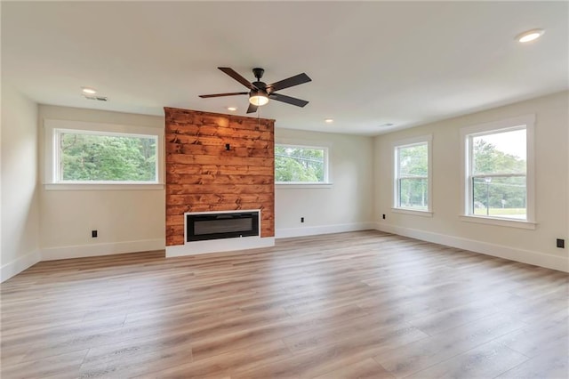 2808 S Arbor Dr, Gainesville, GA 30507 - unfurnished living room featuring a fireplace, light wood-type flooring, baseboards, ceiling fan, and recessed lighting