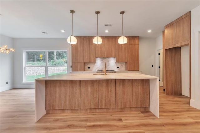 2808 S Arbor Dr, Gainesville, GA 30507 - kitchen featuring light countertops, modern cabinets, light wood-type flooring, backsplash, and recessed lighting