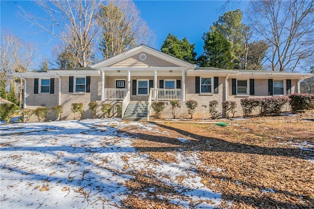 single story home featuring covered porch