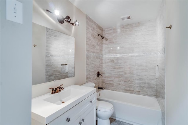 bathroom with toilet, visible vents, bathtub / shower combination, and vanity