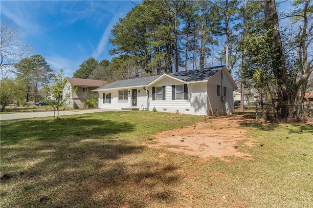 view of front of house with fence, a front yard, and crawl space