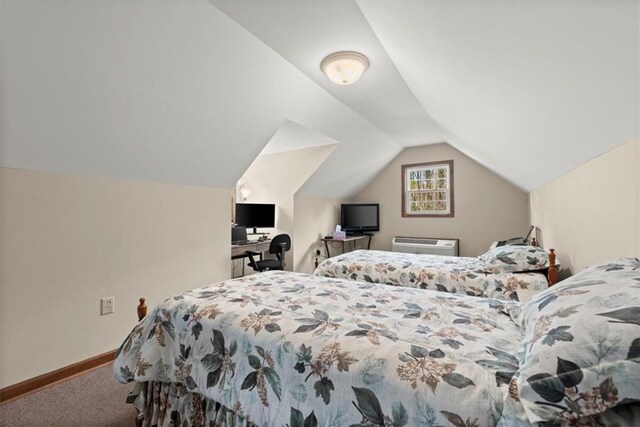 carpeted bedroom featuring baseboards, vaulted ceiling, and a wall mounted AC