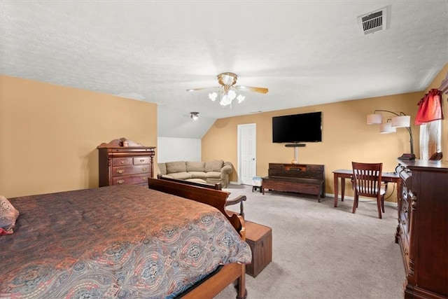 bedroom with lofted ceiling, light carpet, a ceiling fan, visible vents, and baseboards