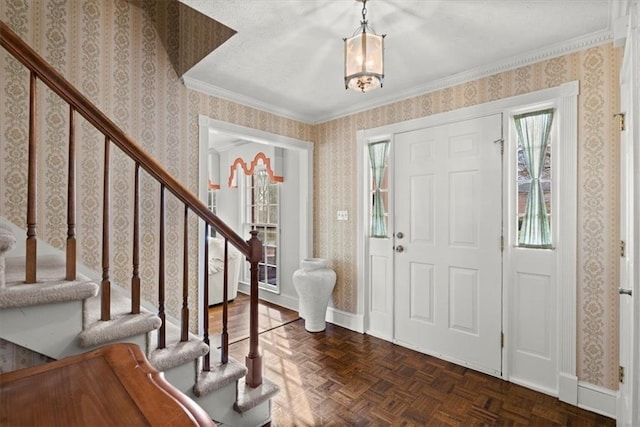 entryway with wallpapered walls, stairway, and baseboards