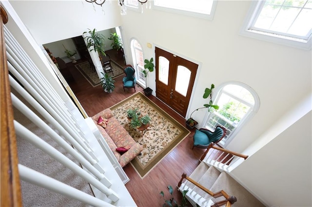 5452 Old Dalton Rd NE, Calhoun, GA 30701 - foyer with healthy amount of natural light, a high ceiling, wood finished floors, and a chandelier