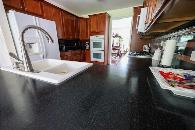 5452 Old Dalton Rd NE, Calhoun, GA 30701 - kitchen featuring backsplash, double oven, stainless steel gas cooktop, and a peninsula