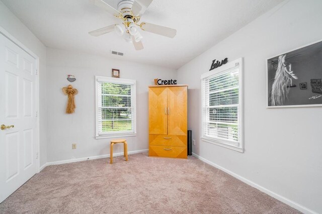 842 Third St, Stone Mountain, GA 30083 - unfurnished bedroom with multiple windows, carpet floors, and baseboards